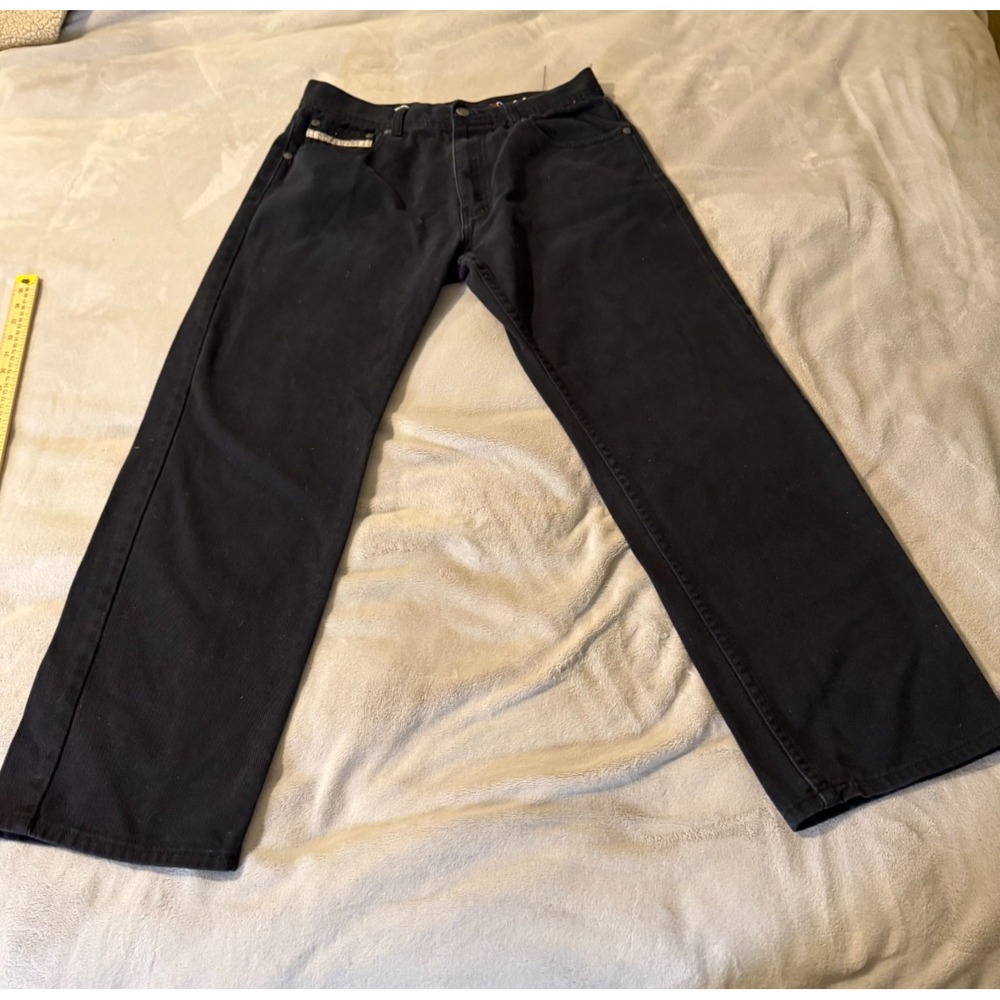 Classic AKDMKS (Akademiks) dark-wash denim jeans featuring embroidered rear pock